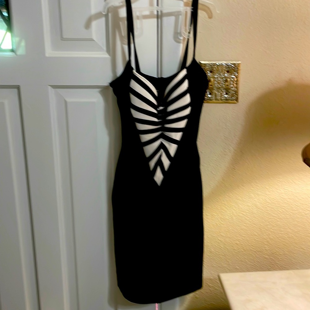 ..thick stretchy black material gives the illusion of hourglass shape
